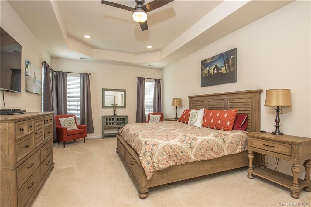 5149 Waterloo Drive Tega Cay, SC 29708 - Photo 12 of 28 a bedroom with a bed and furniture