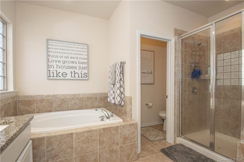 5149 Waterloo Drive Tega Cay, SC 29708 - Photo 16 of 28 a bathroom with a bathtub and shower