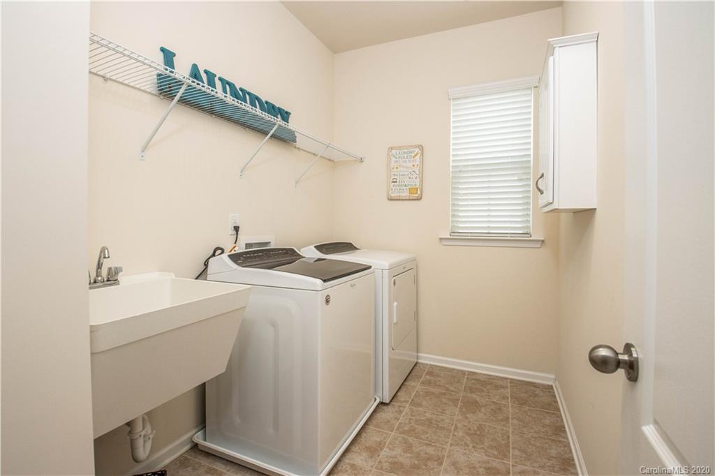 5149 Waterloo Drive Tega Cay, SC 29708 - Photo 18 of 28 a utility room with dryer and washer