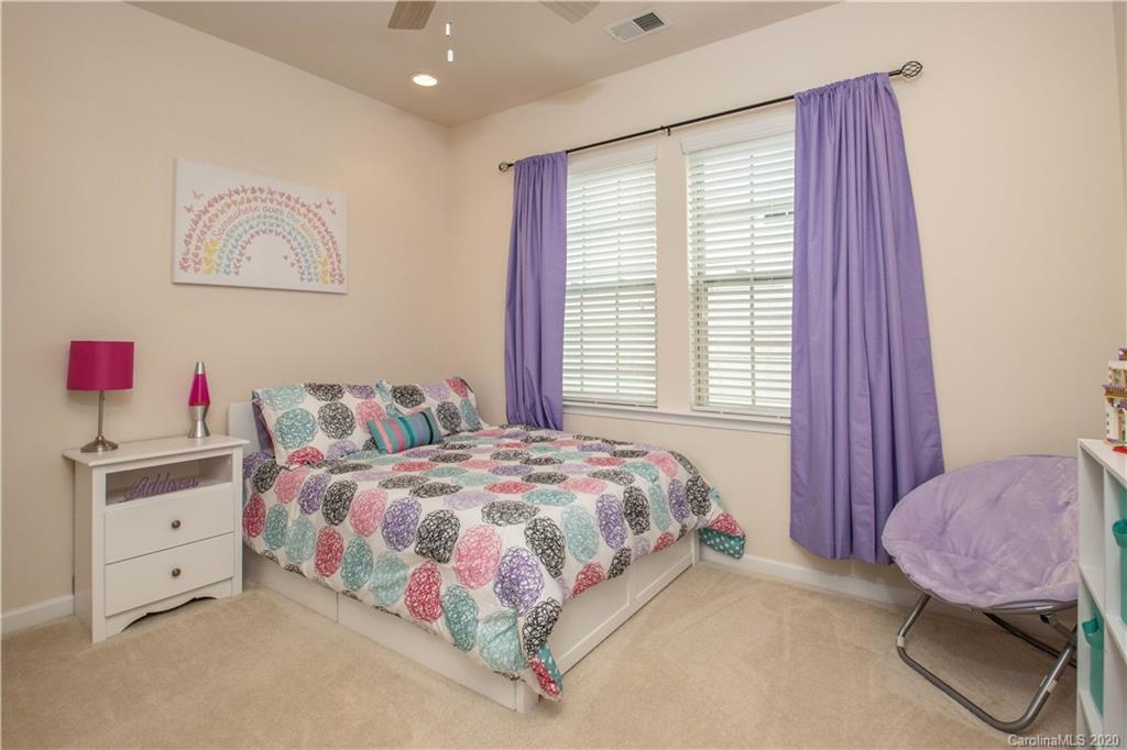 5149 Waterloo Drive Tega Cay, SC 29708 - Photo 21 of 28 a bedroom with a bed and a window