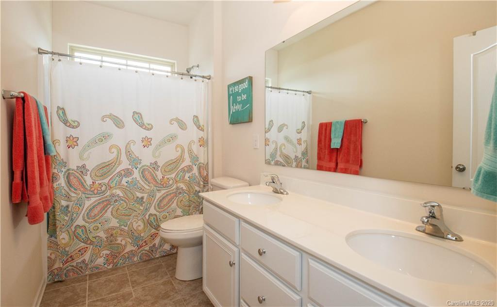 5149 Waterloo Drive Tega Cay, SC 29708 - Photo 22 of 28 a bathroom with a sink and a mirror