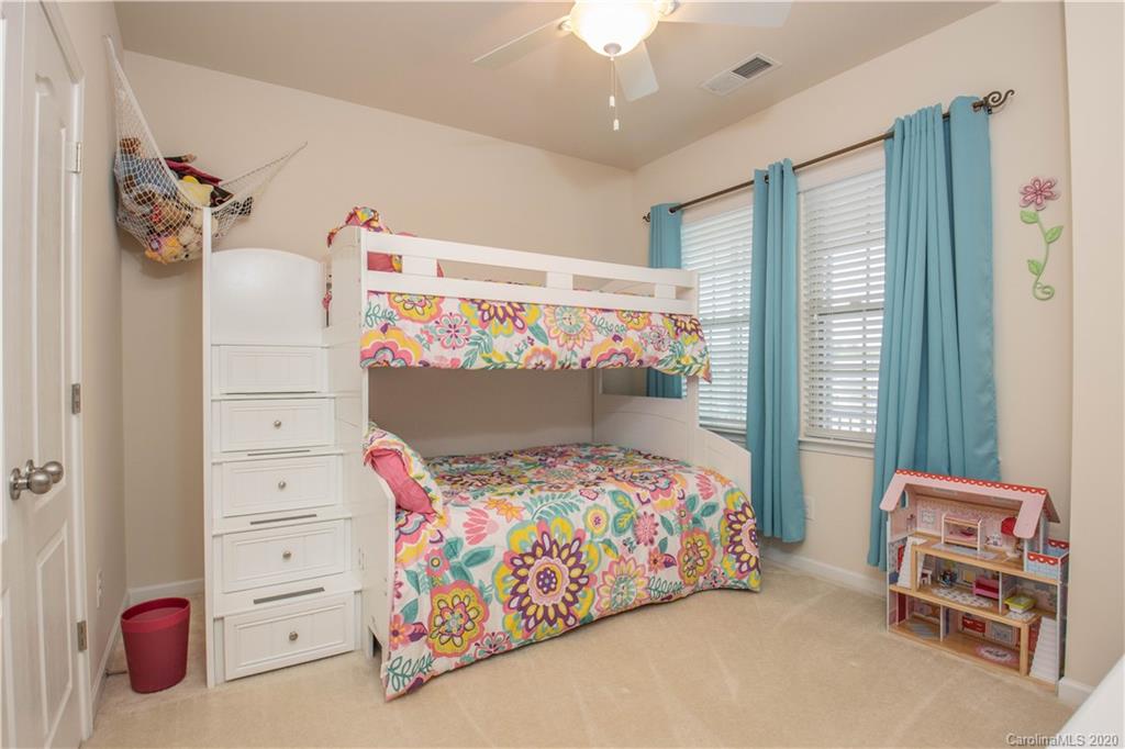 5149 Waterloo Drive Tega Cay, SC 29708 - Photo 23 of 28 a bedroom with a bed and a window