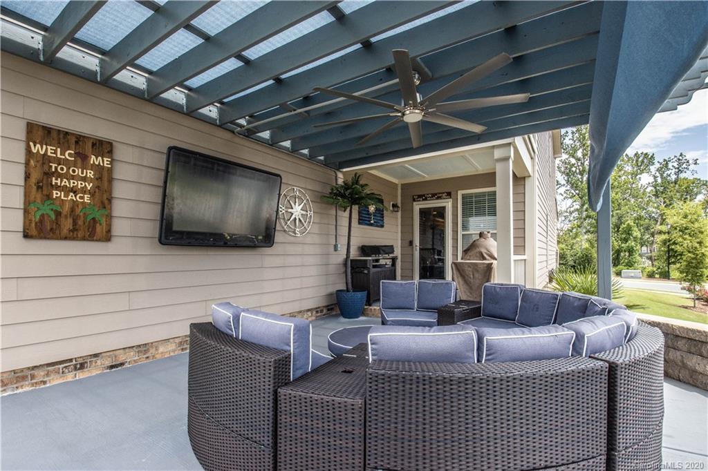 5149 Waterloo Drive Tega Cay, SC 29708 - Photo 25 of 28 a living room with fireplace furniture and a flat screen tv