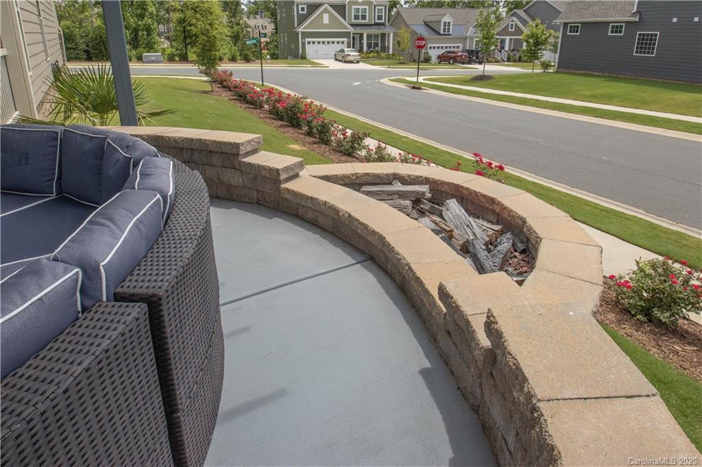 5149 Waterloo Drive Tega Cay, SC 29708 - Photo 26 of 28 a view of a swimming pool with a yard