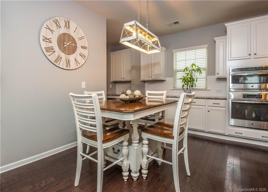 5149 Waterloo Drive Tega Cay, SC 29708 - Photo 5 of 28 a kitchen with a table and chairs in it