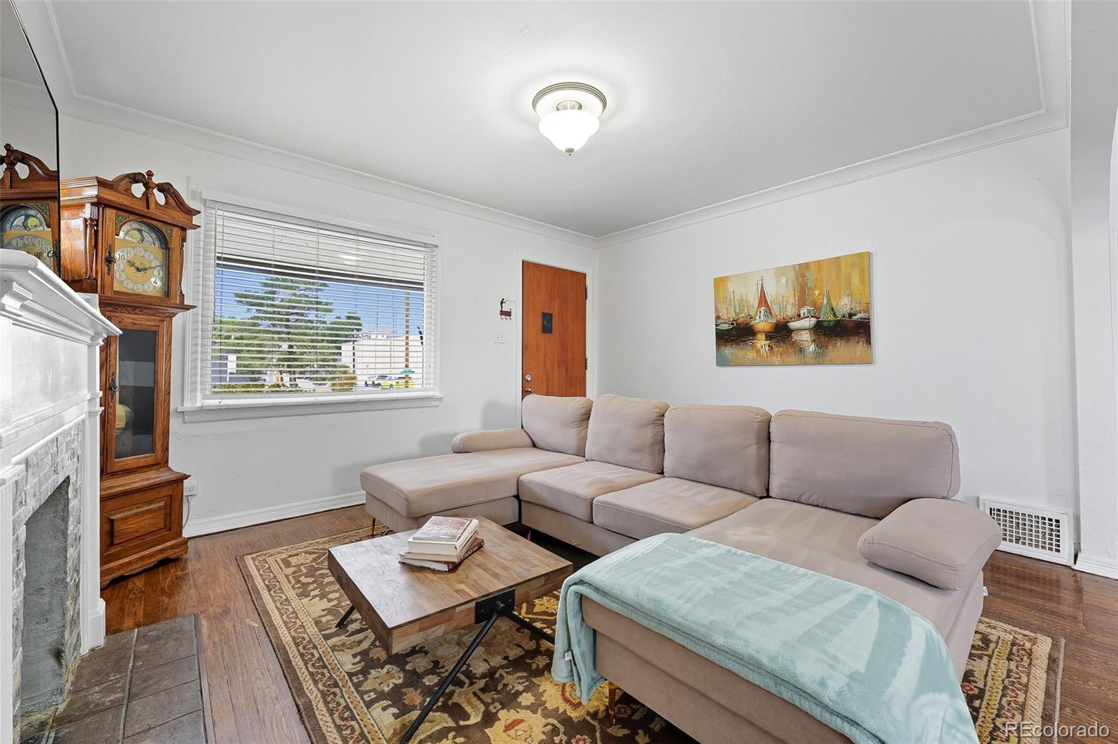 1280 Harrison Street Denver, CO 80206 - Photo 12 of 50 a living room with furniture and a window