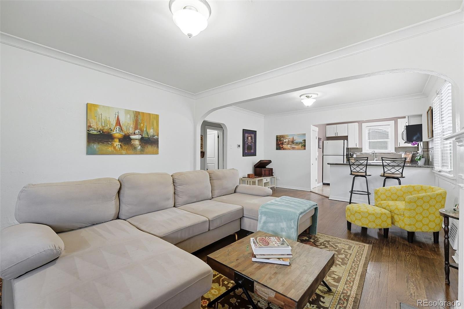 1280 Harrison Street Denver, CO 80206 - Photo 13 of 50 a living room with furniture and a table