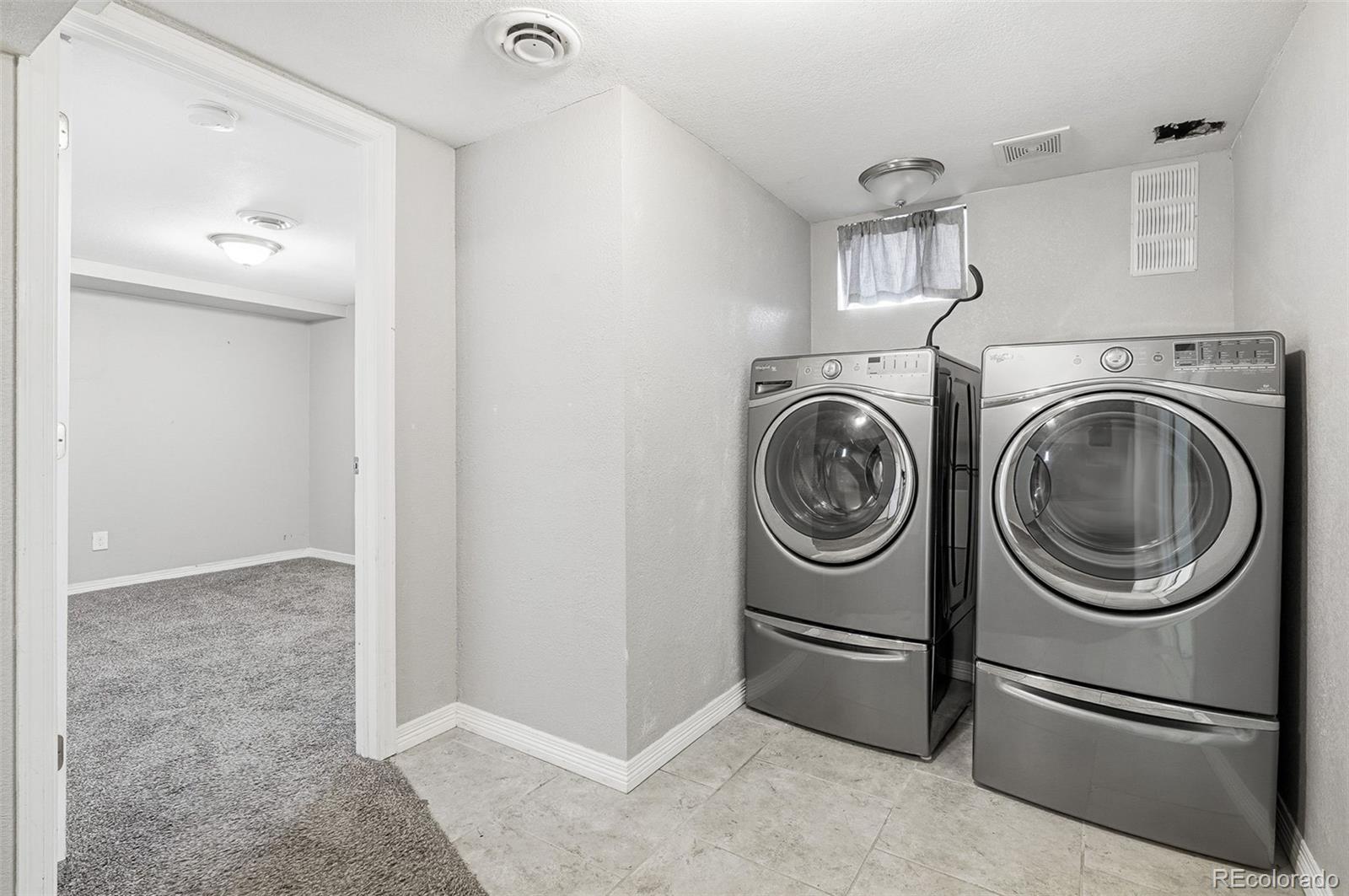 1280 Harrison Street Denver, CO 80206 - Photo 33 of 50 a utility room with dryer and washer