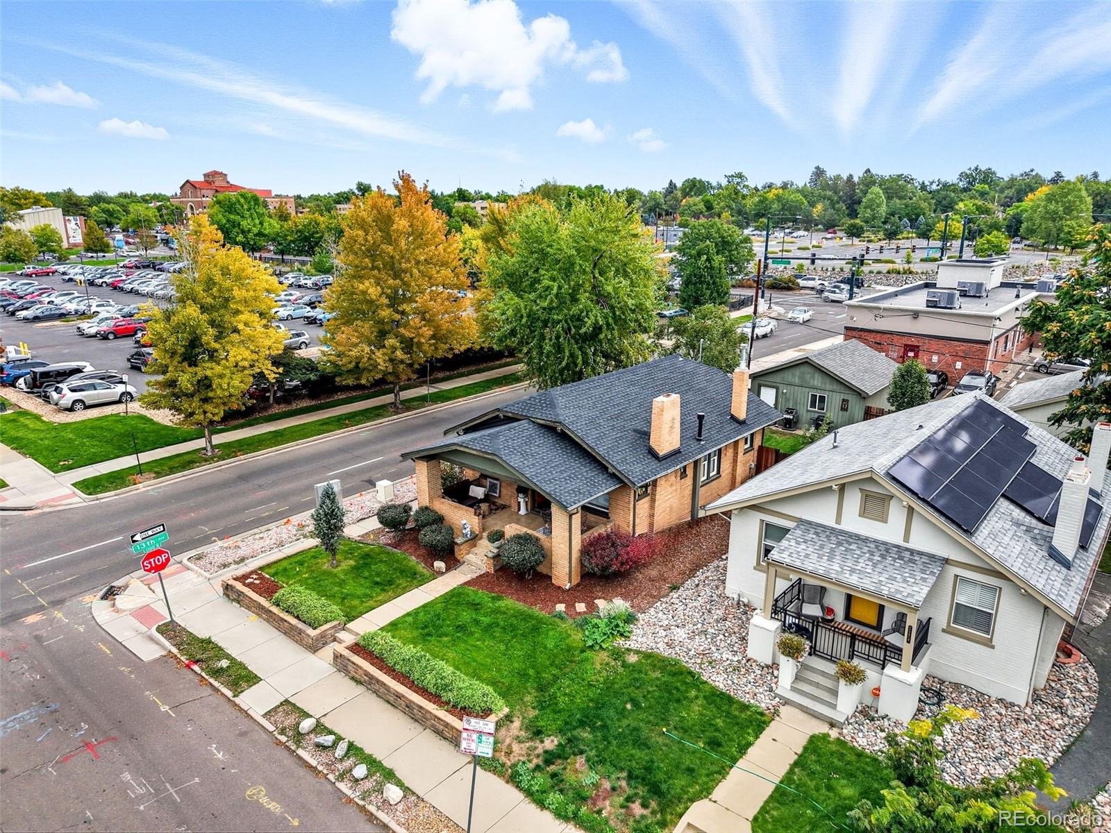 1280 Harrison Street Denver, CO 80206 - Photo 45 of 50 an aerial view of a house with a garden and mountain view