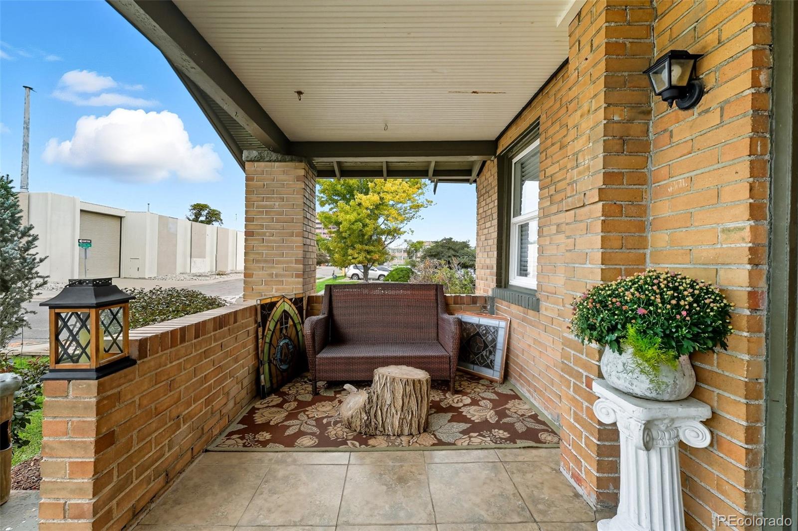 1280 Harrison Street Denver, CO 80206 - Photo 8 of 50 a outdoor living space with furniture and a potted plant