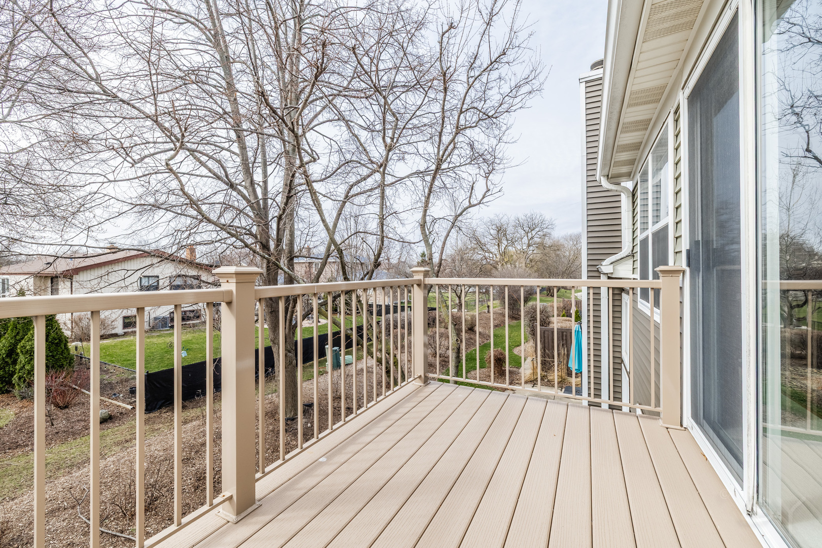 274 Wildspring Court Itasca, IL 60143 - Photo 14 of 42 a view of a balcony with wooden floor and fence