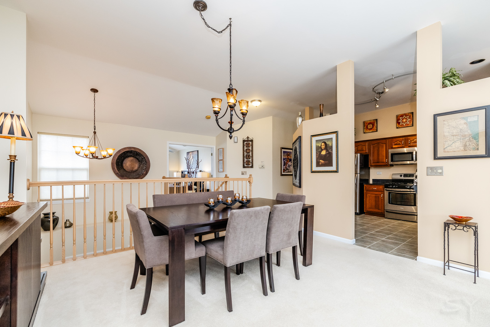 274 Wildspring Court Itasca, IL 60143 - Photo 17 of 42 a view of a dining room and livingroom with furniture wooden floor a chandelier