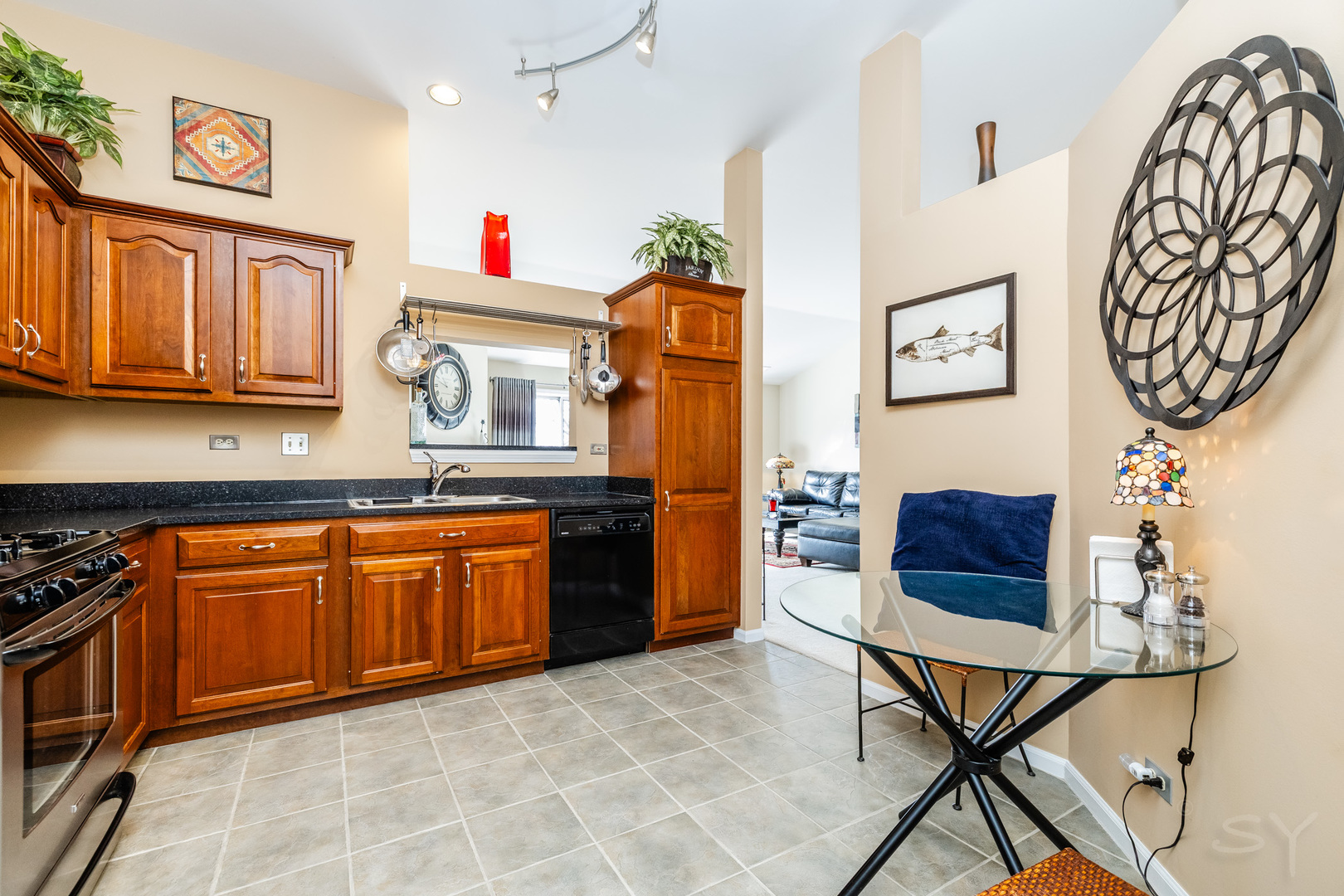 274 Wildspring Court Itasca, IL 60143 - Photo 19 of 42 a kitchen with stainless steel appliances granite countertop a sink and a refrigerator