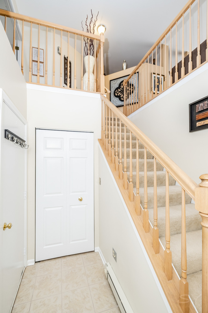 274 Wildspring Court Itasca, IL 60143 - Photo 2 of 42 a view of an entryway with staircase