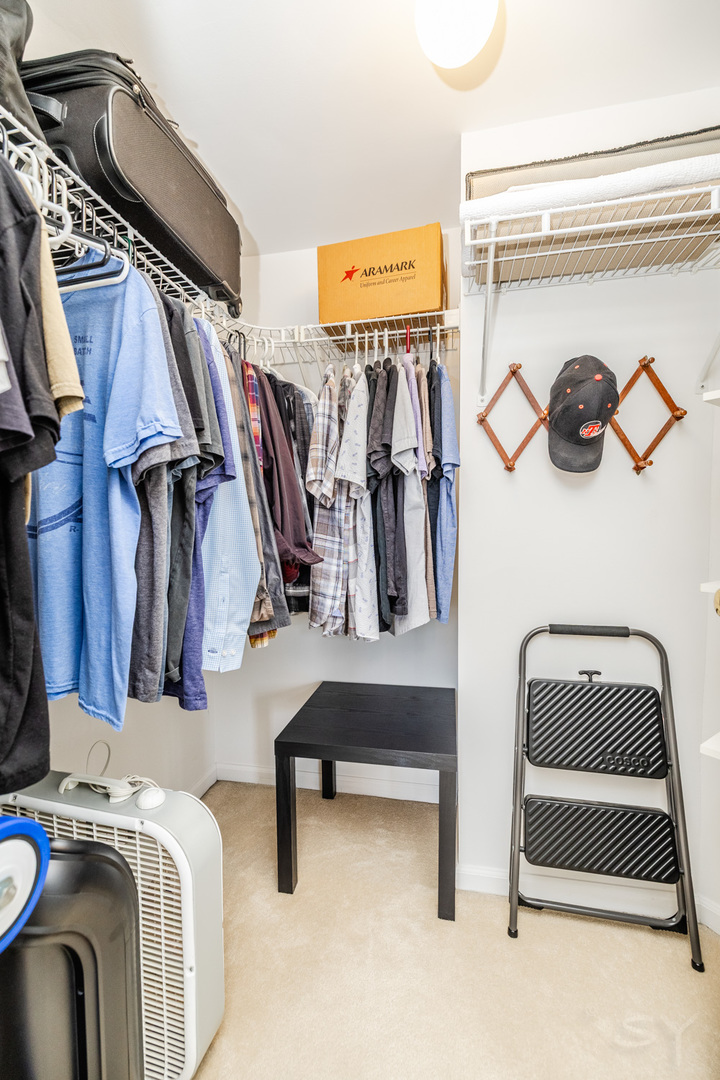 274 Wildspring Court Itasca, IL 60143 - Photo 26 of 42 a view of walk in closet with clothes and shoes