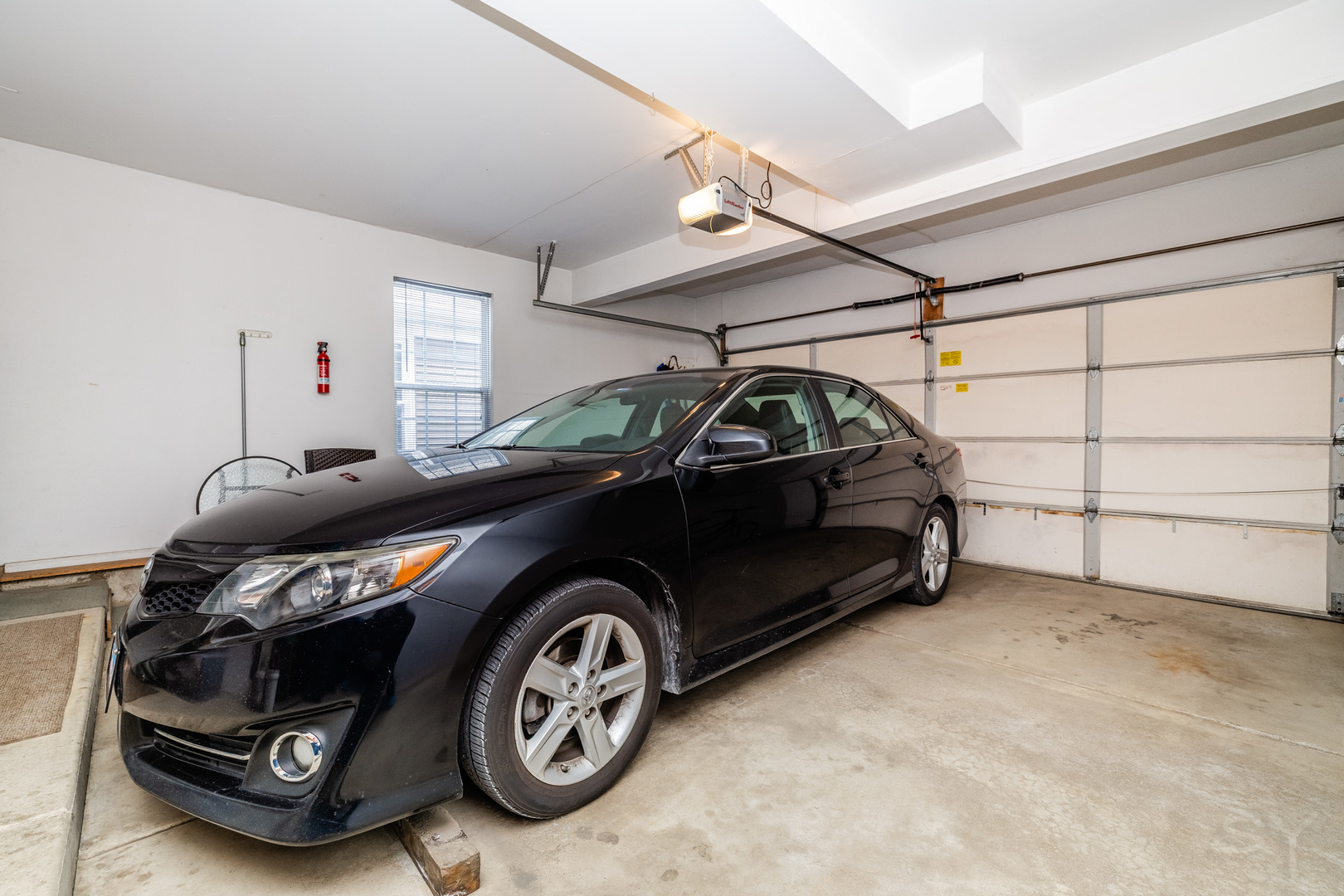 274 Wildspring Court Itasca, IL 60143 - Photo 38 of 42 a car parked in a garage