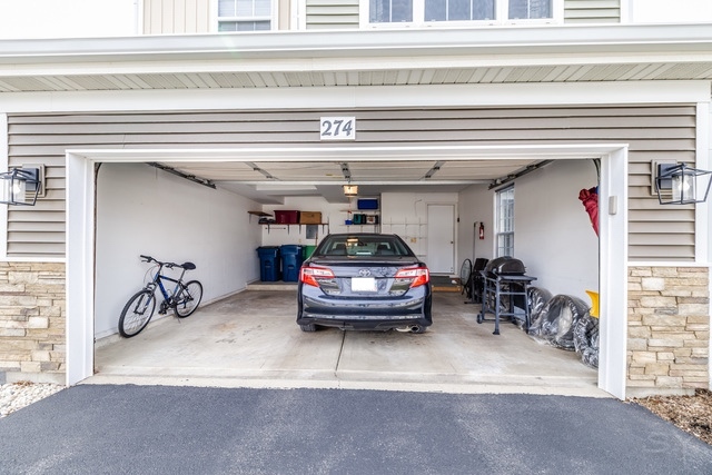274 Wildspring Court Itasca, IL 60143 - Photo 39 of 42 a car parked in front of garage