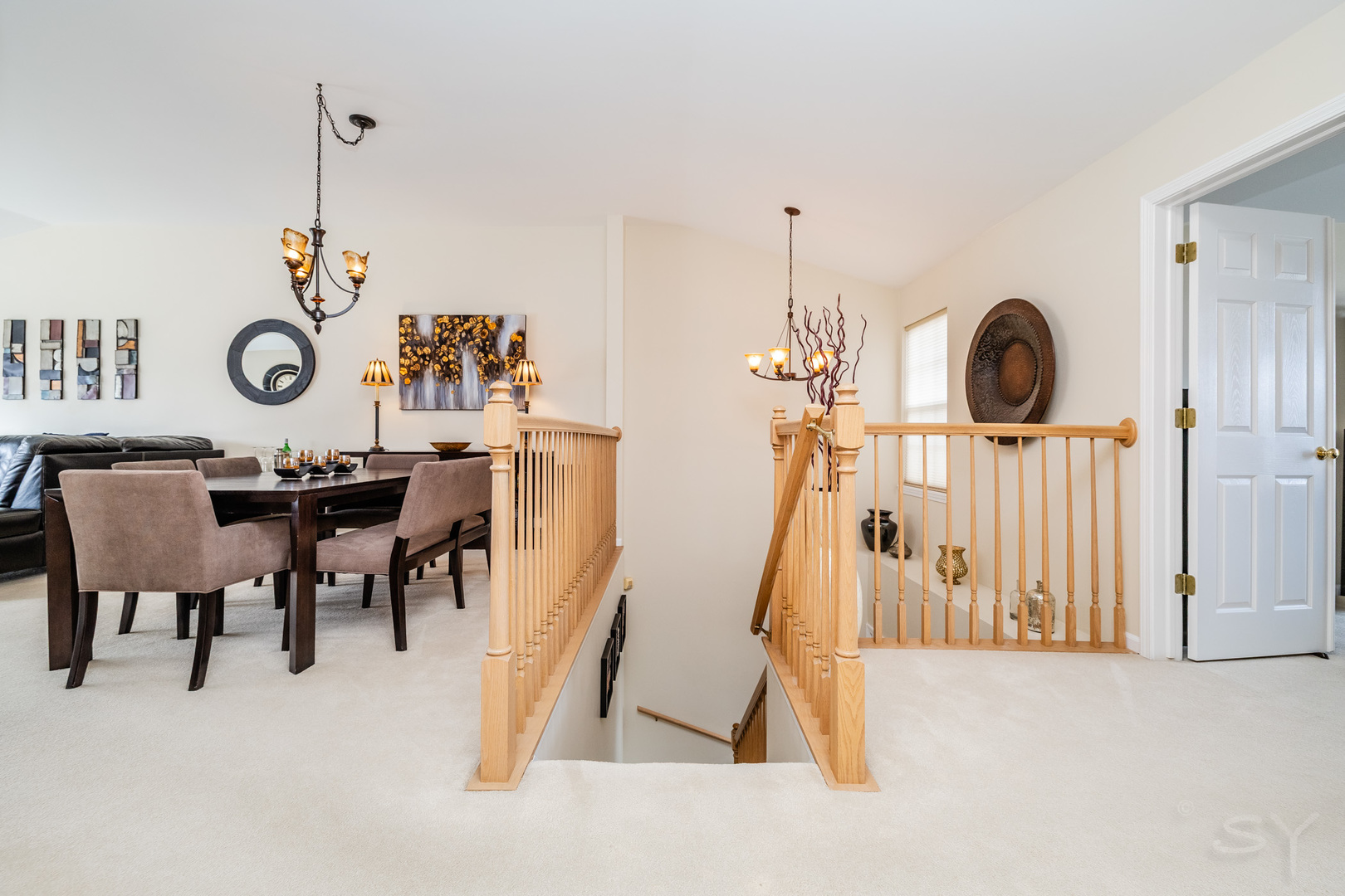 274 Wildspring Court Itasca, IL 60143 - Photo 4 of 42 a view of a dining room with furniture and a chandelier