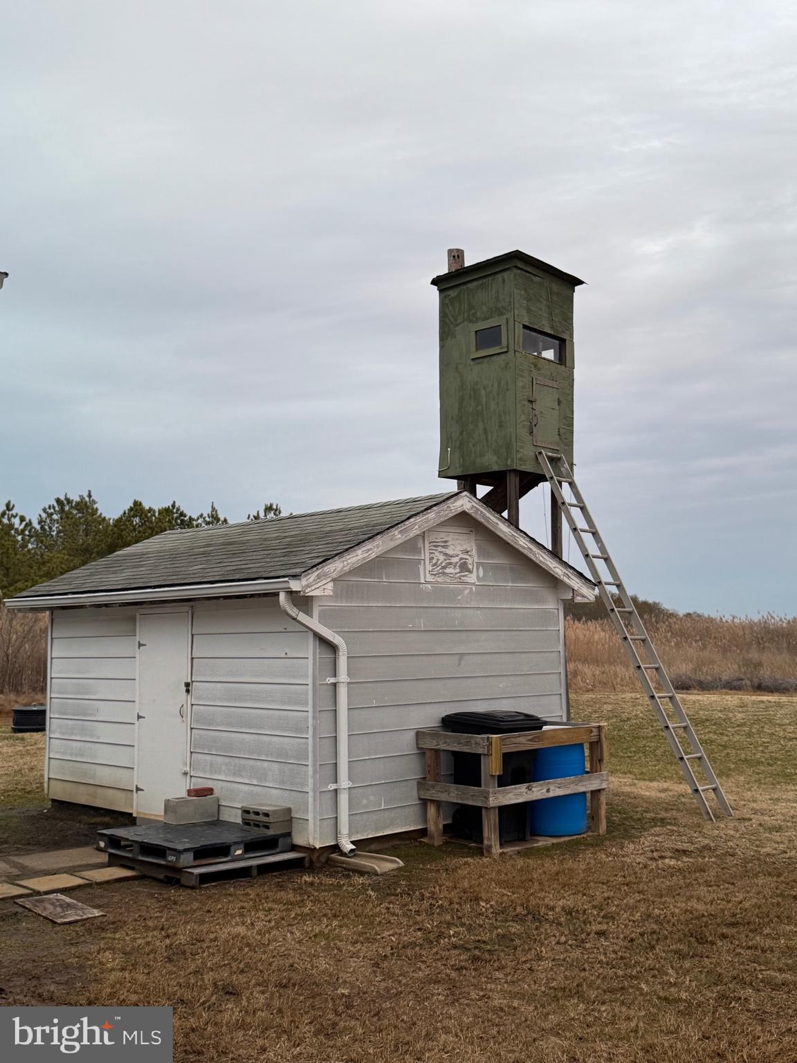 2728 Sandy Island Road Crapo, MD 21626 - Photo 3 of 15 a view of a small house with a wooden deck