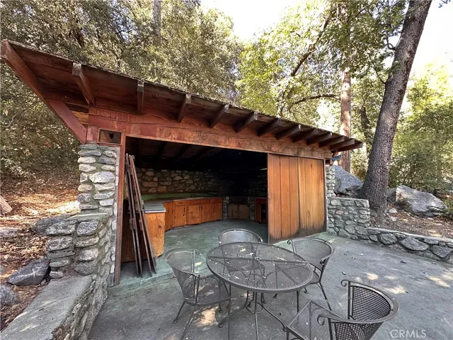 a front view of house with outdoor seating