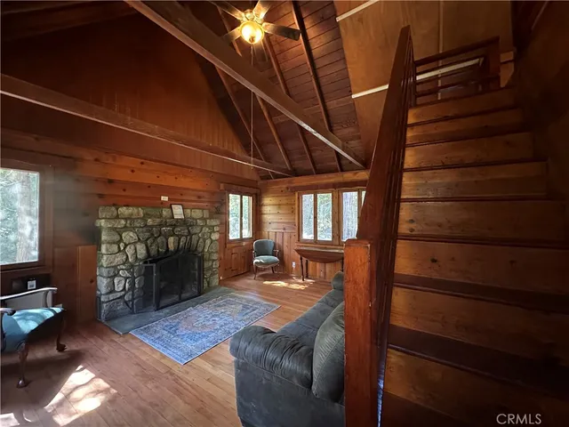 a view of a livingroom with furniture and a ceiling fan