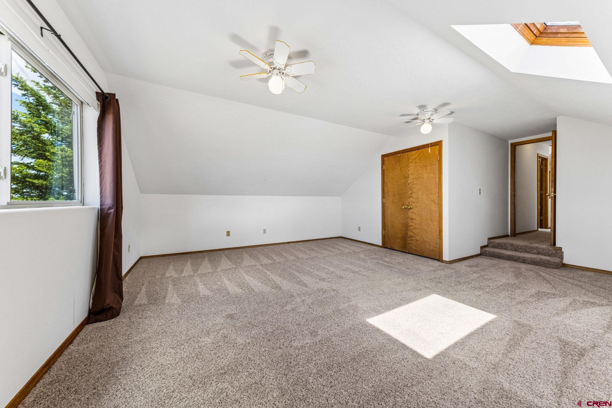 22480 Rd L Cortez, CO 81321 - Photo 24 of 44 an empty room with windows and closet
