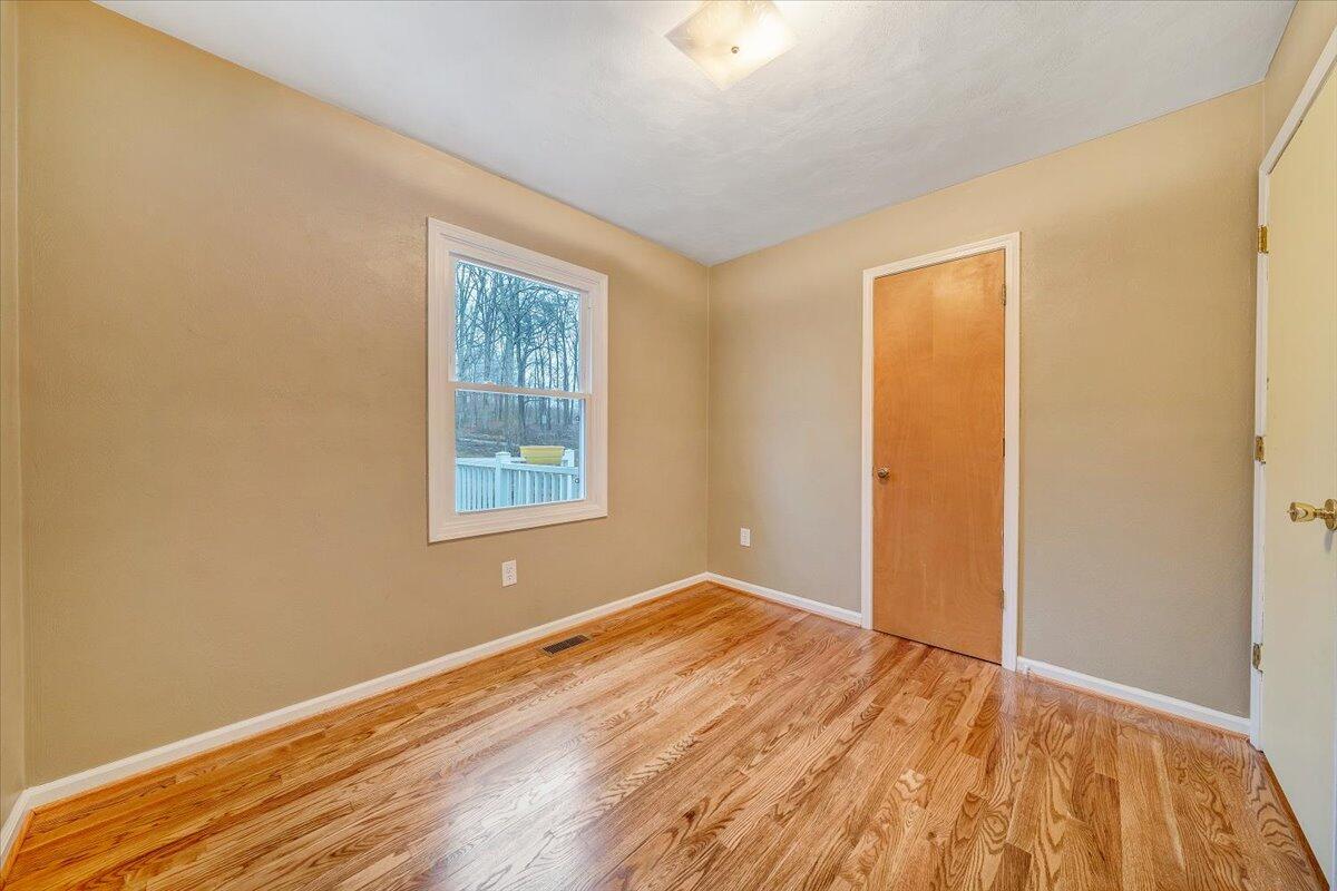 5146 Keffer Road Catawba, VA 24070 - Photo 14 of 43 a view of empty room with wooden floor and fan