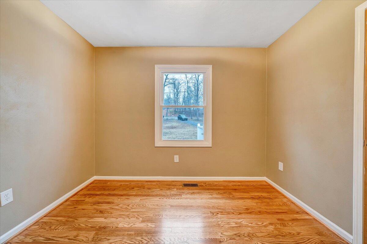 5146 Keffer Road Catawba, VA 24070 - Photo 15 of 43 a view of an empty room with window and wooden floor
