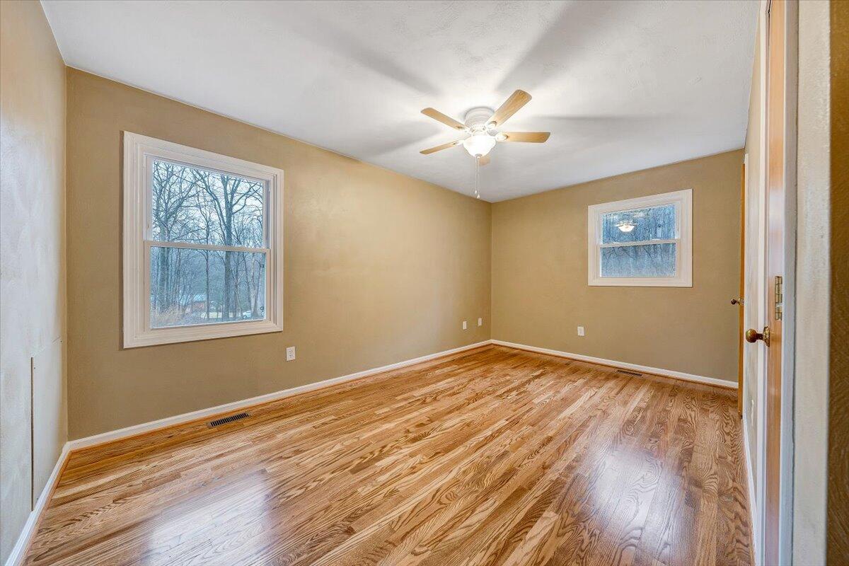 5146 Keffer Road Catawba, VA 24070 - Photo 18 of 43 a view of an empty room with wooden floor and a window