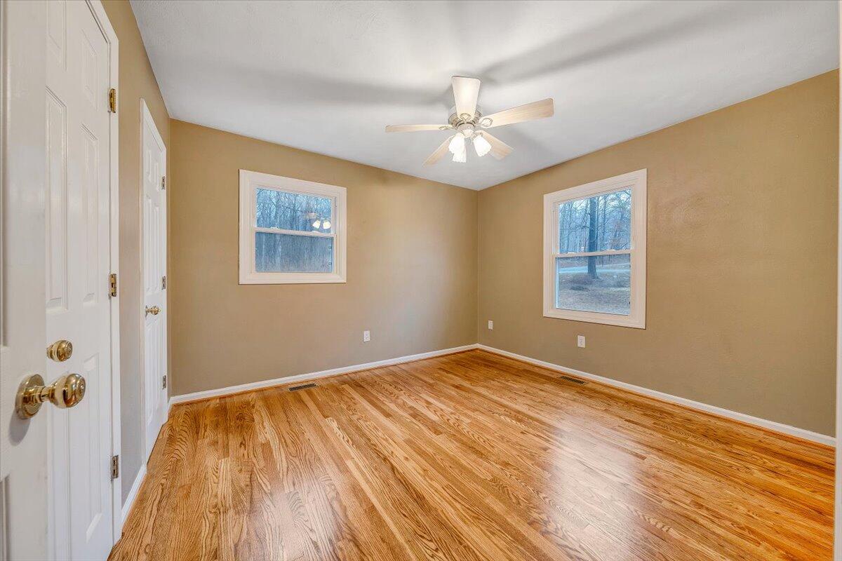 5146 Keffer Road Catawba, VA 24070 - Photo 21 of 43 wooden floor in an empty room with a window