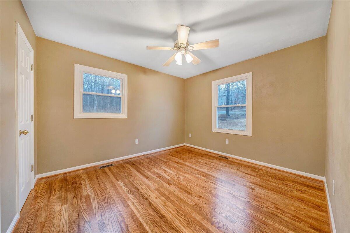 5146 Keffer Road Catawba, VA 24070 - Photo 22 of 43 a view of an empty room with wooden floor and a window