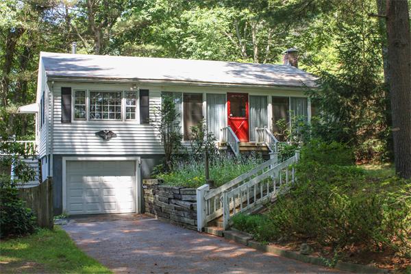26 Gilson Road Littleton, MA 01460 - Photo 1 of 18 a front view of a house with a porch