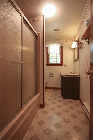 26 Gilson Road Littleton, MA 01460 - Photo 11 of 18 a view of a bathroom with a sink and a mirror
