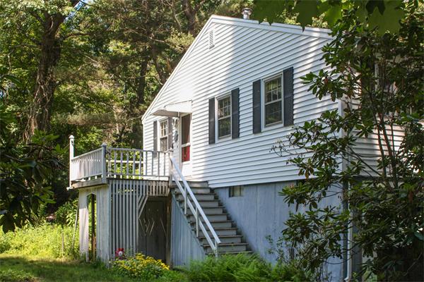 26 Gilson Road Littleton, MA 01460 - Photo 2 of 18 a view of a house with a yard and plants