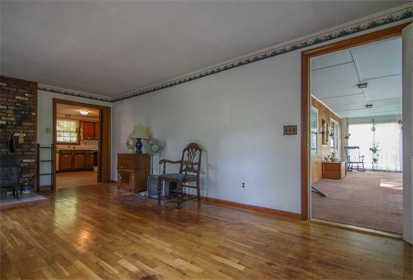 26 Gilson Road Littleton, MA 01460 - Photo 5 of 18 a view of a livingroom with furniture and a kitchen