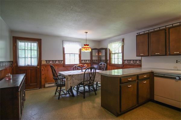 26 Gilson Road Littleton, MA 01460 - Photo 10 of 18 a view of a dining room with furniture and chandelier