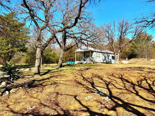 a house with trees in front of it