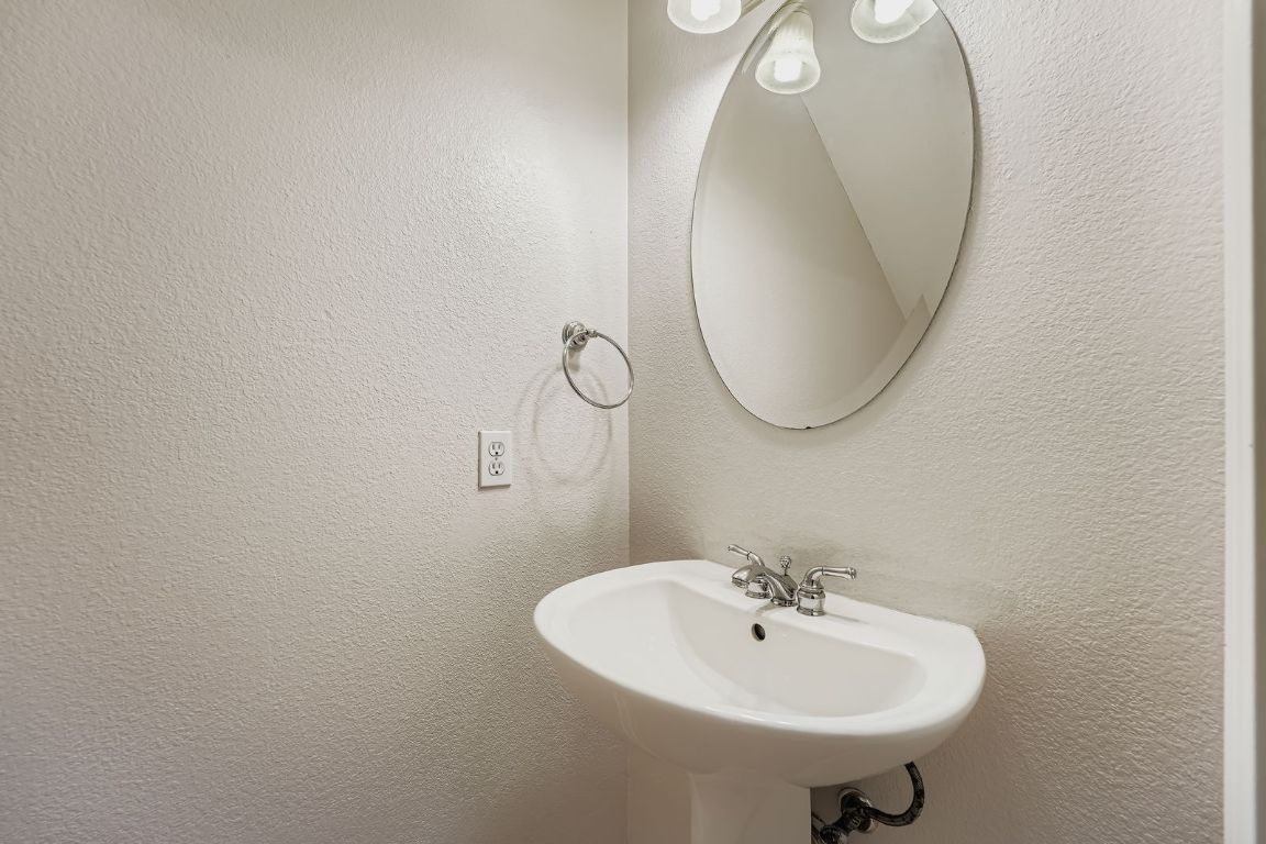 1101 East Parmer Lane, Unit 305 Austin, TX 78753 - Photo 15 of 37 a bathroom with a sink and a mirror