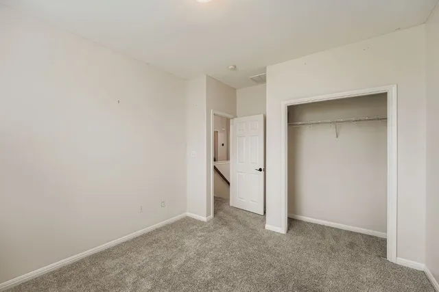 a bathroom with a double vanity sink mirror and bathtub