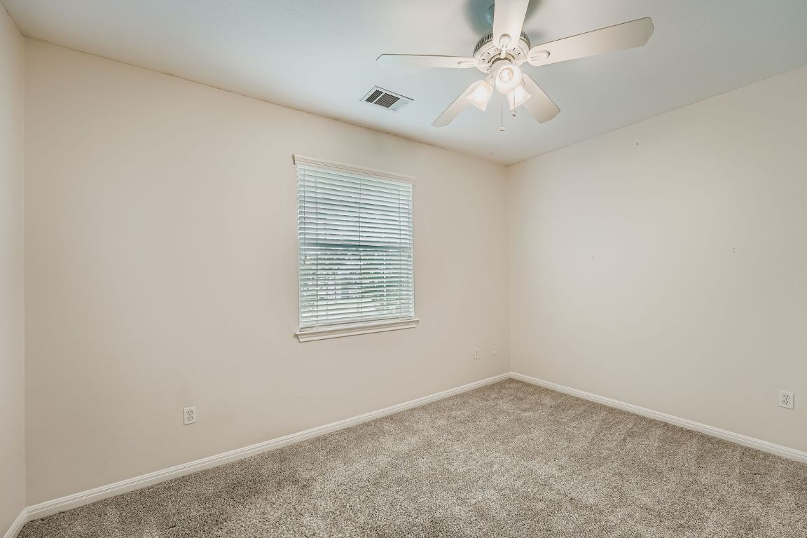 1101 East Parmer Lane, Unit 305 Austin, TX 78753 - Photo 21 of 37 an empty room with windows and fan