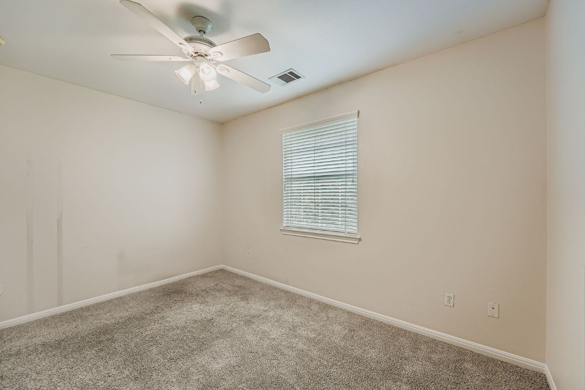 1101 East Parmer Lane, Unit 305 Austin, TX 78753 - Photo 22 of 37 an empty room with windows and fan