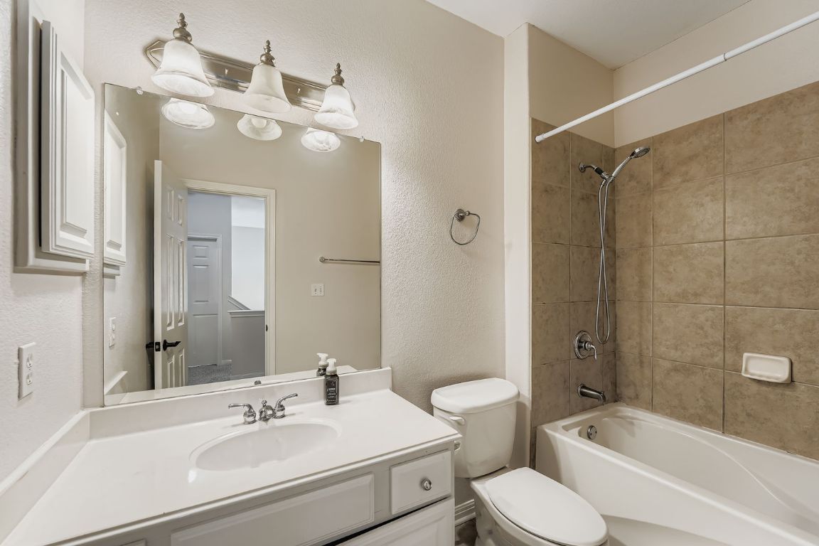 1101 East Parmer Lane, Unit 305 Austin, TX 78753 - Photo 28 of 37 a bathroom with a sink toilet tub and shower