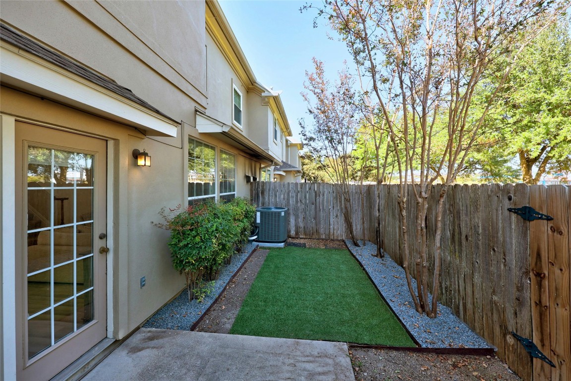 1101 East Parmer Lane, Unit 305 Austin, TX 78753 - Photo 30 of 37 a view of a house with a yard