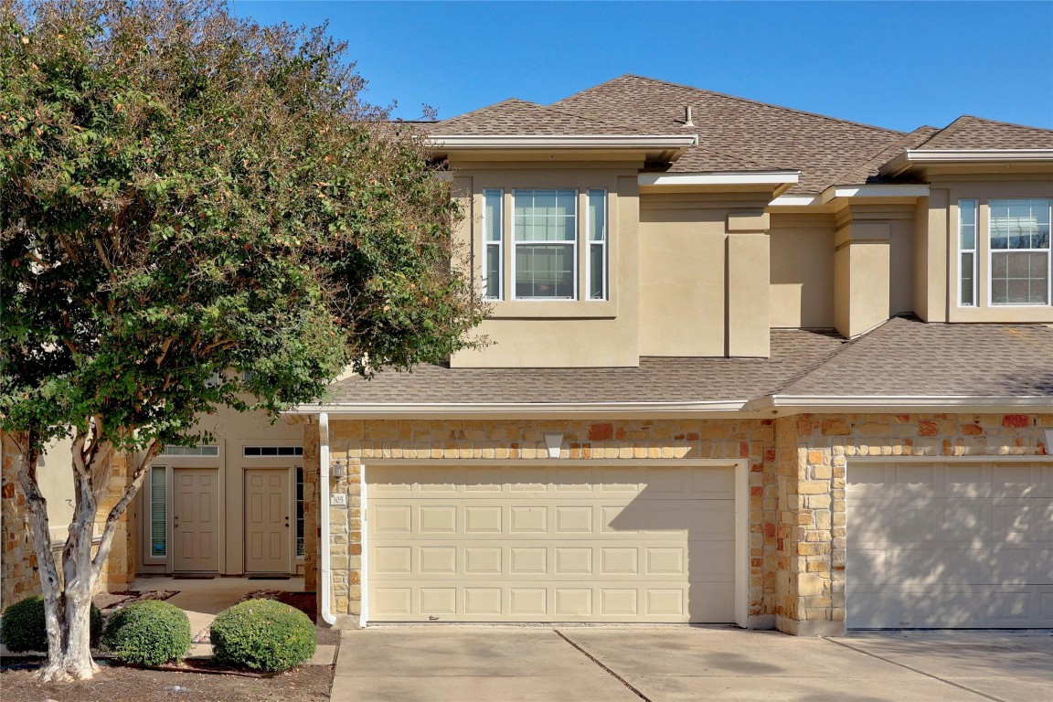 1101 East Parmer Lane, Unit 305 Austin, TX 78753 - Photo 4 of 37 a front view of a house with garden