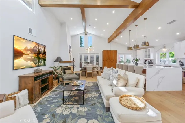 a living room with fireplace furniture and a flat screen tv