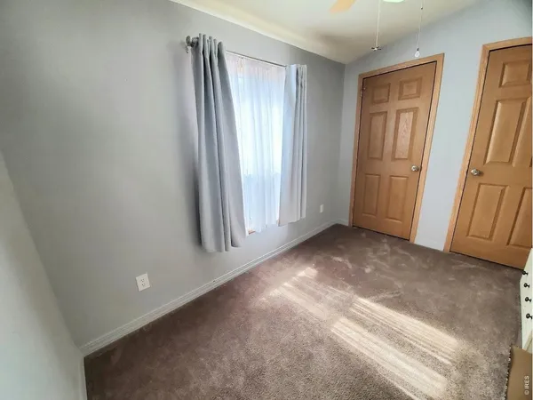 a view of livingroom with furniture and windows