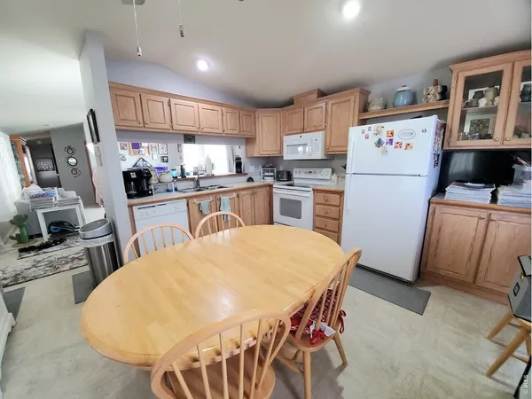 a kitchen with refrigerator and stove