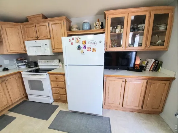 a kitchen with stainless steel appliances a refrigerator sink and cabinets