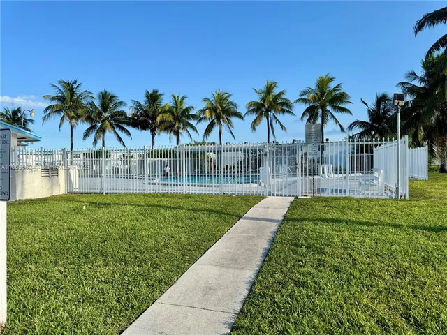 a view of outdoor space with a garden and swimming pool