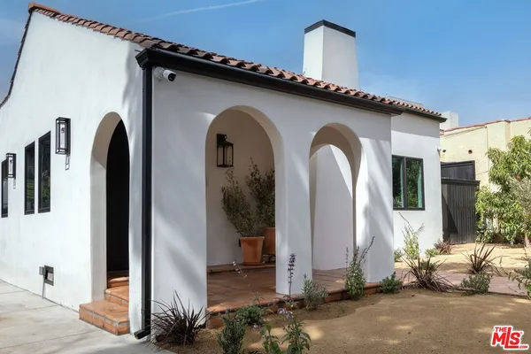 a front view of a house with parking